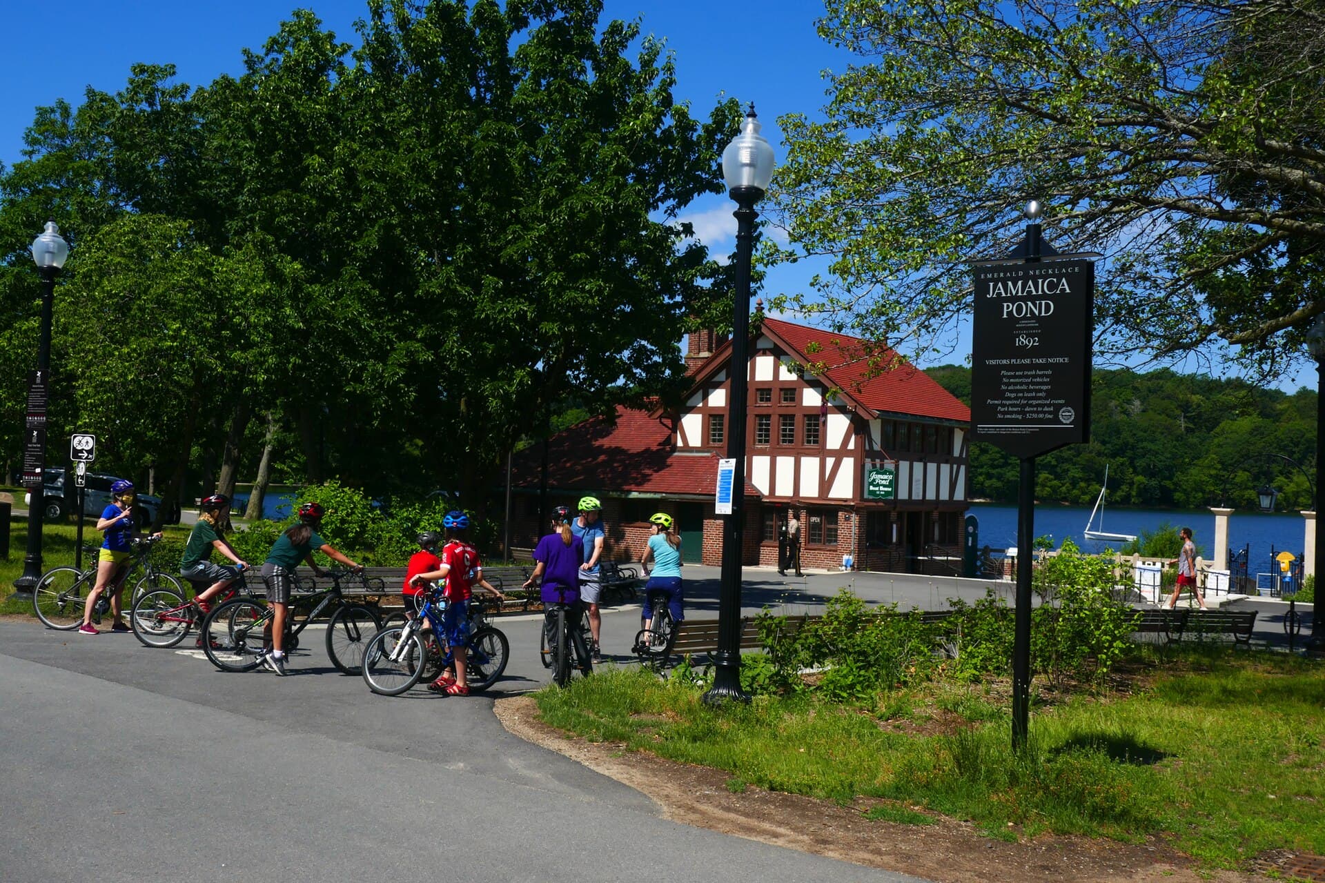 Cyclists by the Jamaica Pond boathouse in Jamaica Plain