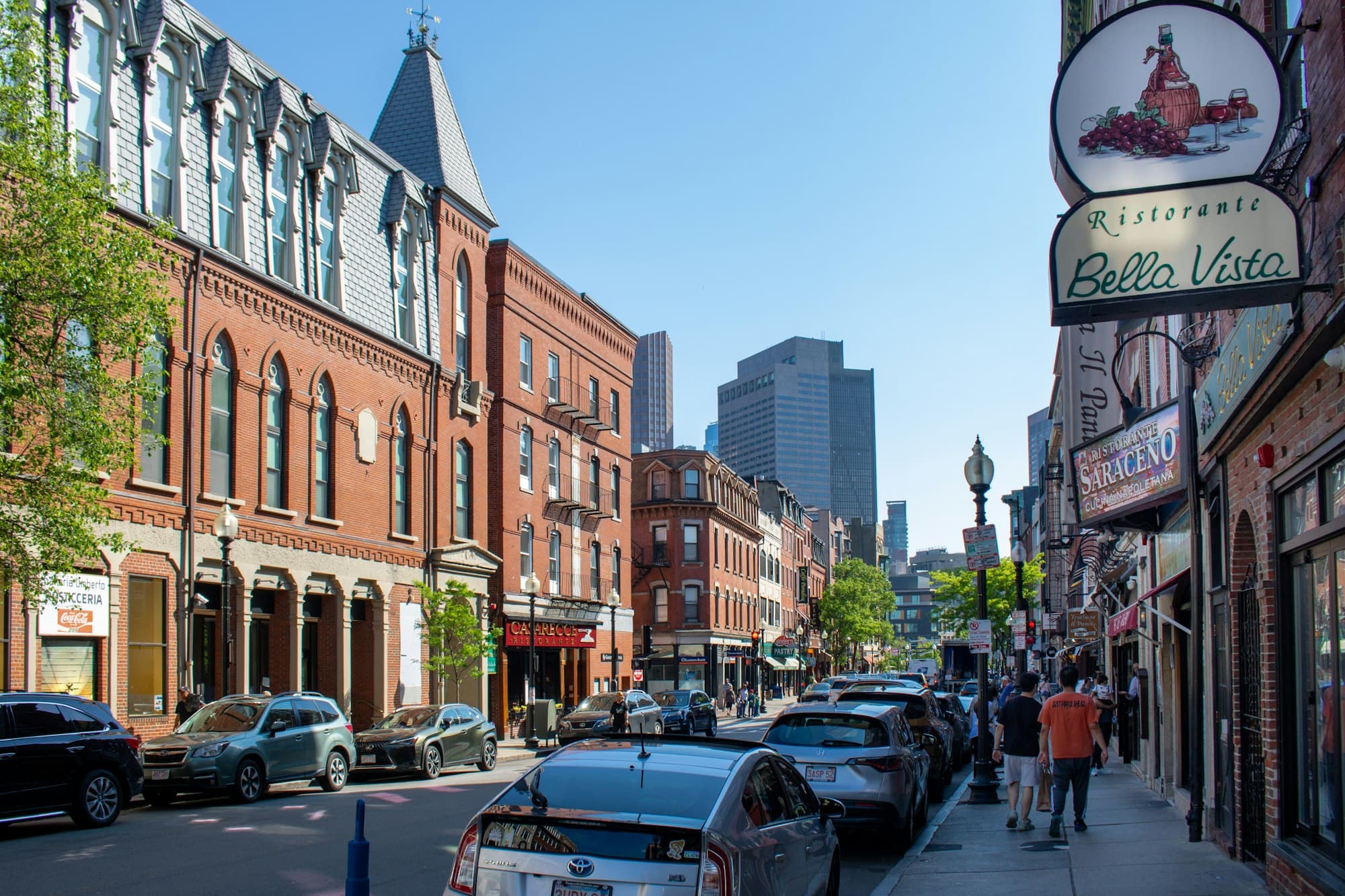Boston street with storefronts and office towers